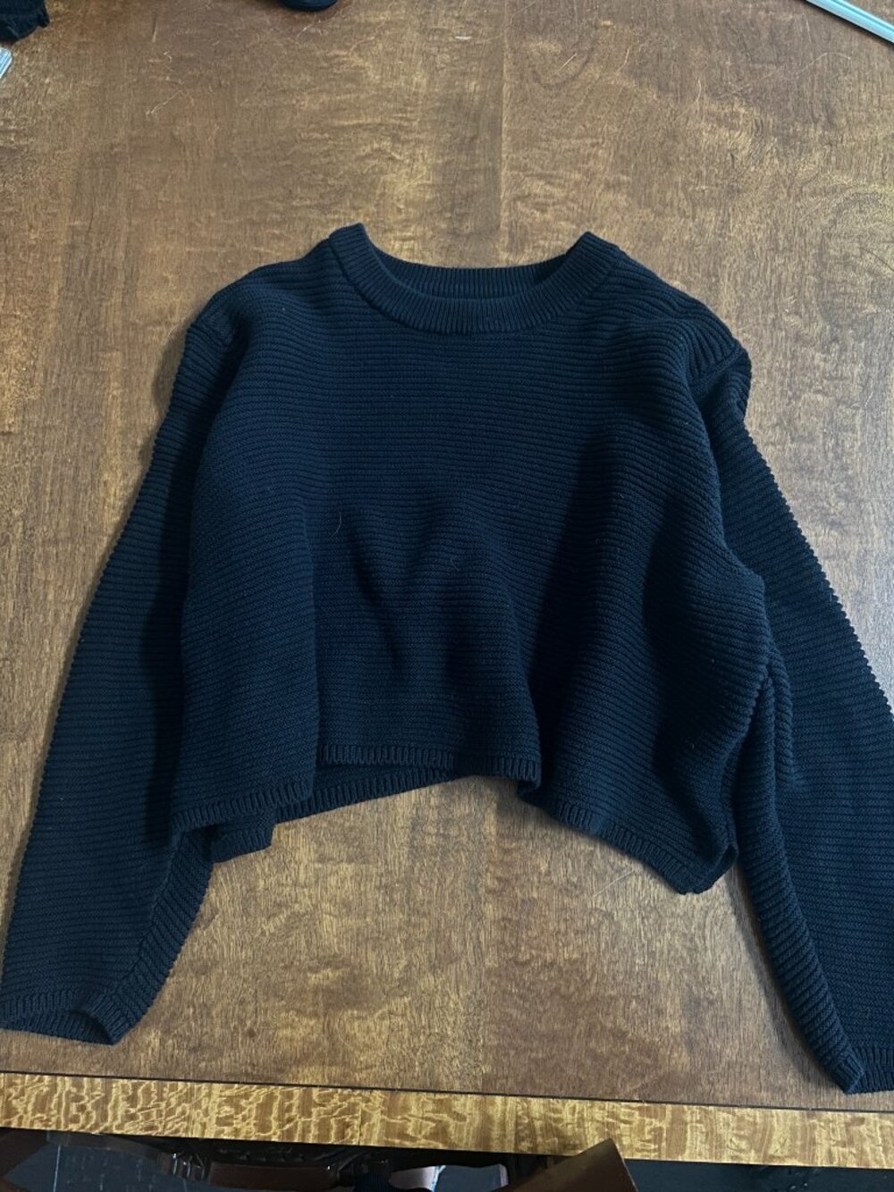 Cropped black knit sweater